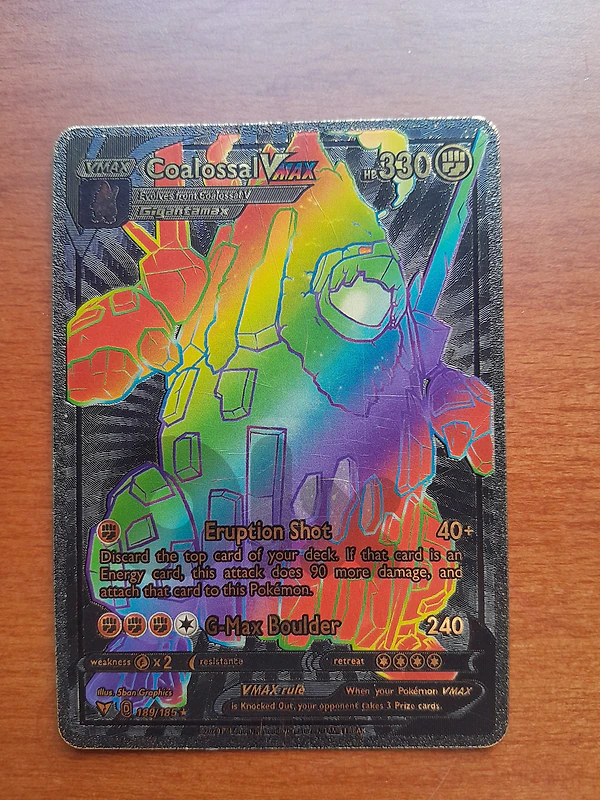 Golden and Black pokemon rare card (coalossal VMAX)