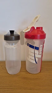 Protein shake bottle and bike water Protein shake bottle and bike water
