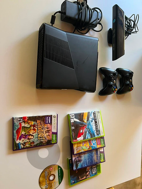 gaming console (Xbox 360 used like new)
