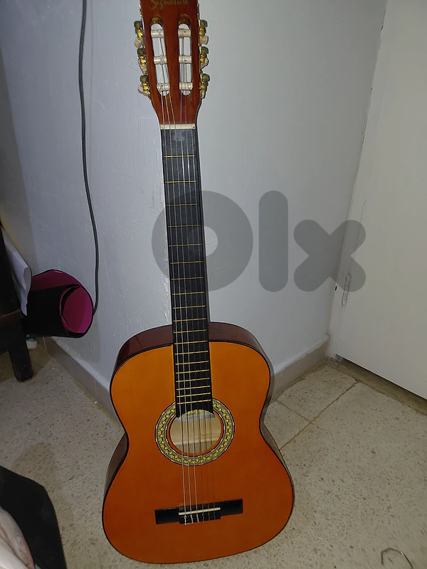 Unused guitar with an instruction book
