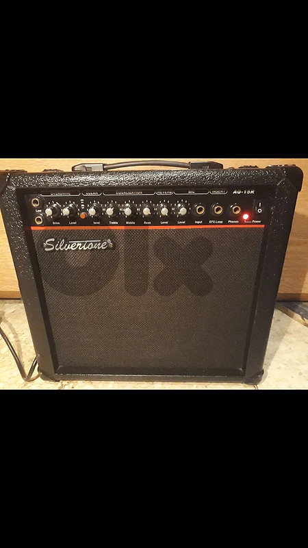 SILVERTONE (AG-15R) solid state guitar combo amplifier 30WATTS Peak 8 inches speaker an incredible clear sounding guitar amp. for its size with effects reverb , overdrive & equalizer the amp still new