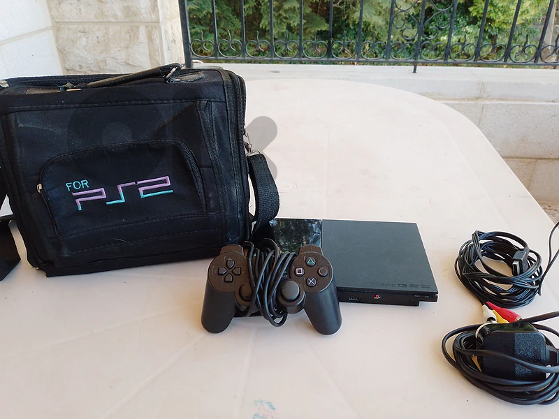 Playstation 2 console (with bag)