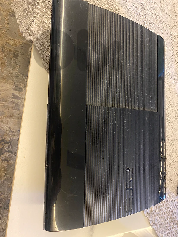 PS3 Slim Console with 2 Original Controllers – Good Condition