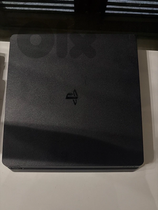 ps4 pro with 3 controller covers(red,blue and black)