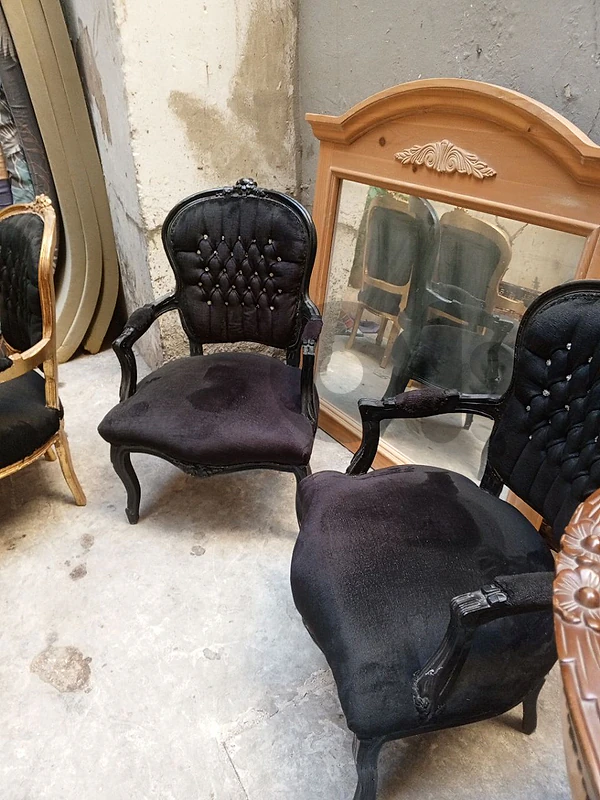 2 black on black armchairs