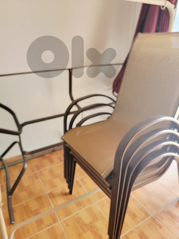 Terrace glass table with 4 chairs.never used