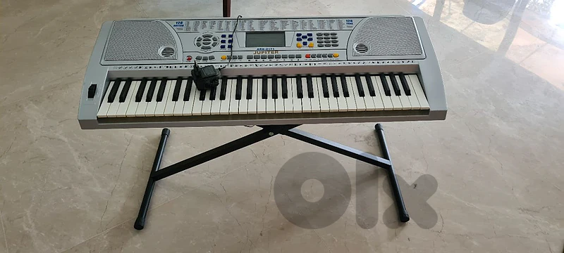 Electronic musical keyboard with stand