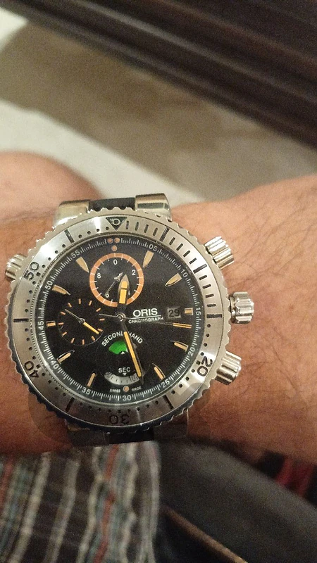 oris watch batery exchange on a hamilton .tissot.raymond weil