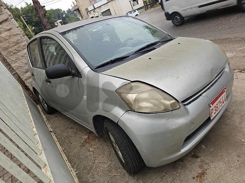 Daihatsu Sirion 2009 + Red Taxi Plate