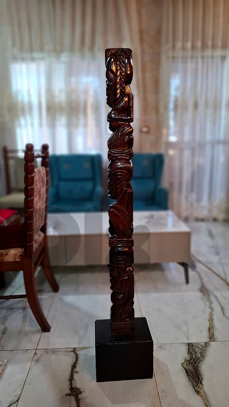 Tribal Elegance: Hand-Carved Hardwood Totem Masterpiece