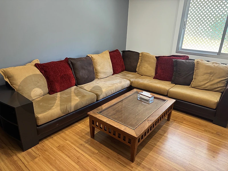 beige sofa with cushions