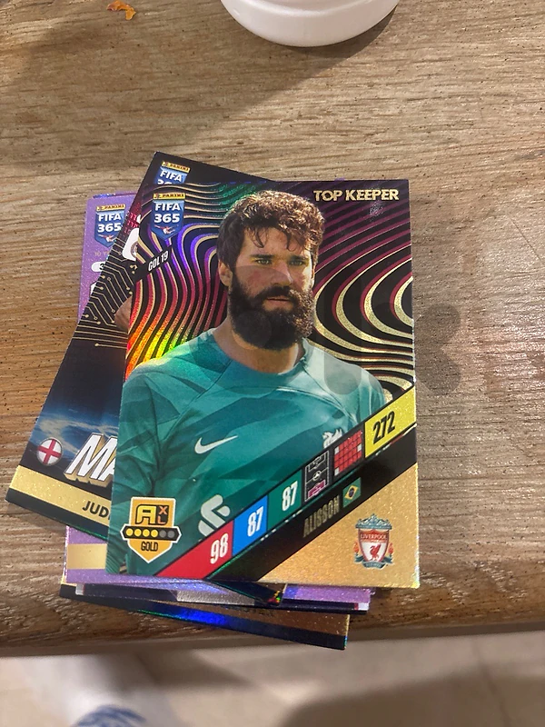 Panini FIFA 365 2024 - Alisson Top Keeper Liverpool (#GOL 19 Gold)