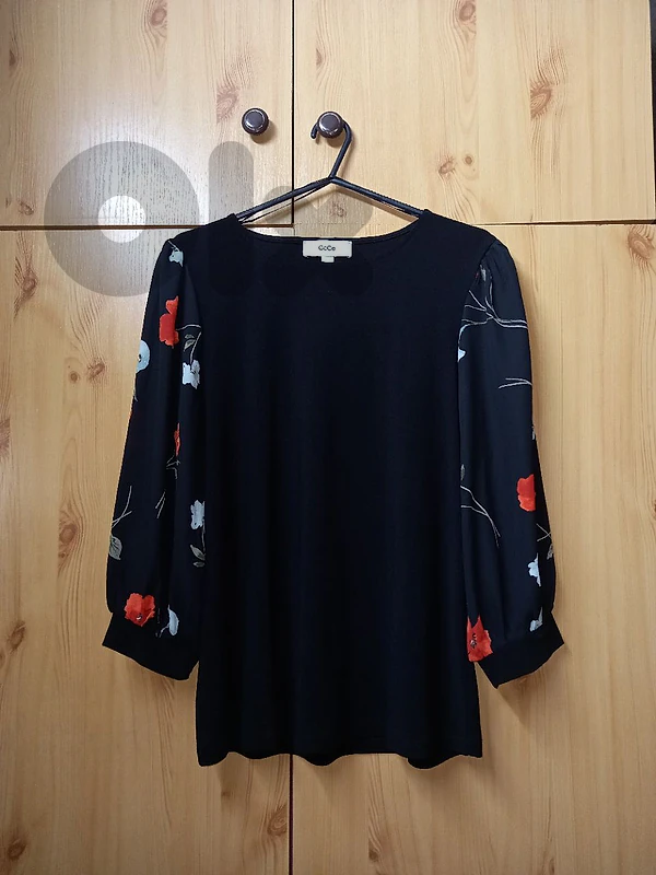 elegant black blouse with floral sleeves