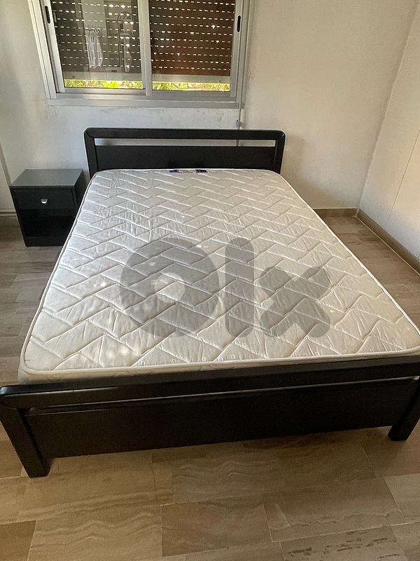 Bed with night table