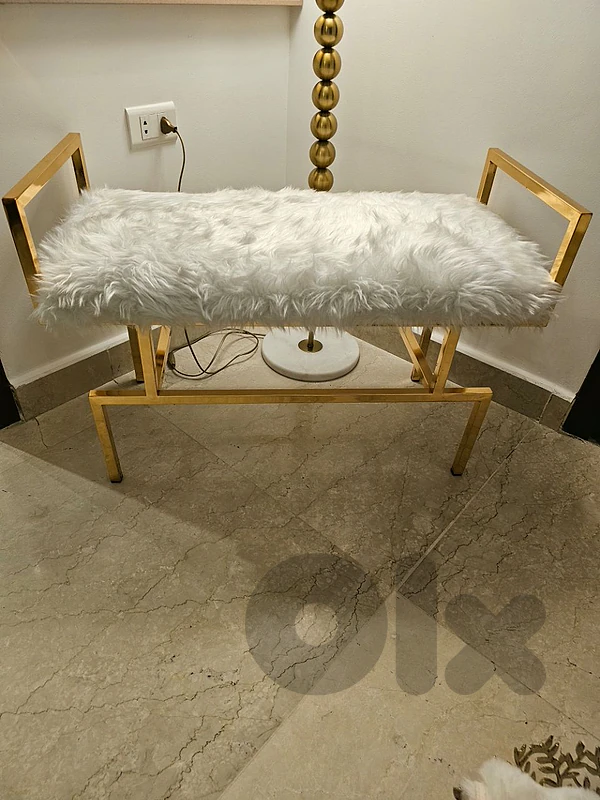 Golden bench with white fur