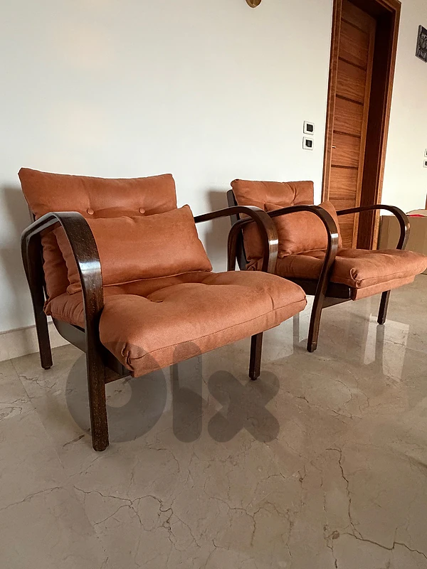 two vintage lounge chairs