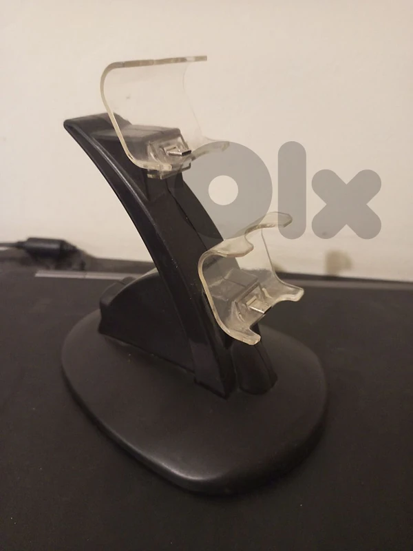 black PS4 controller charging stand