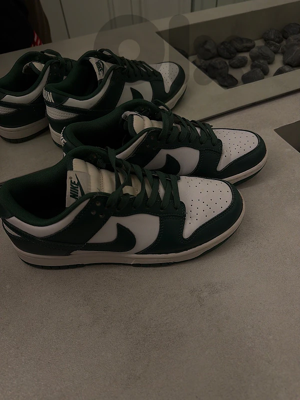 Nike Dunk Low sneakers in a green and white colorway