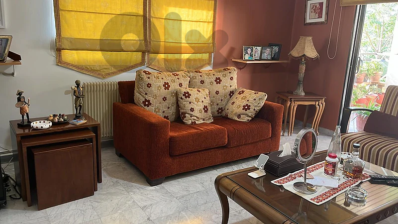 comfortable living room with arm chair .