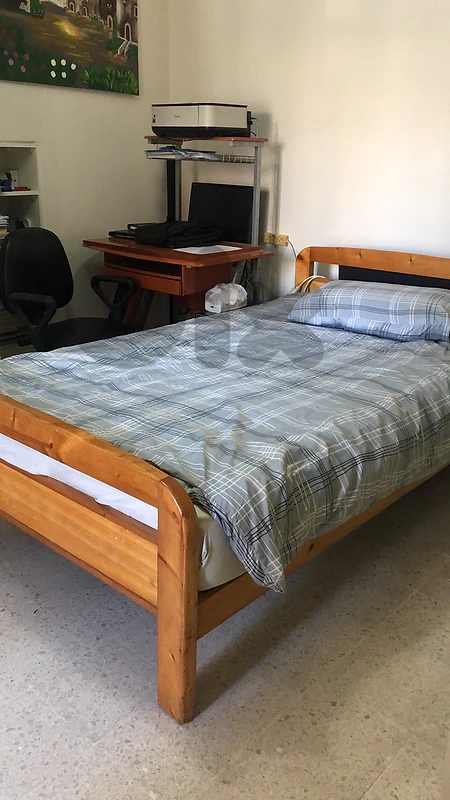 Bed with a computer desk