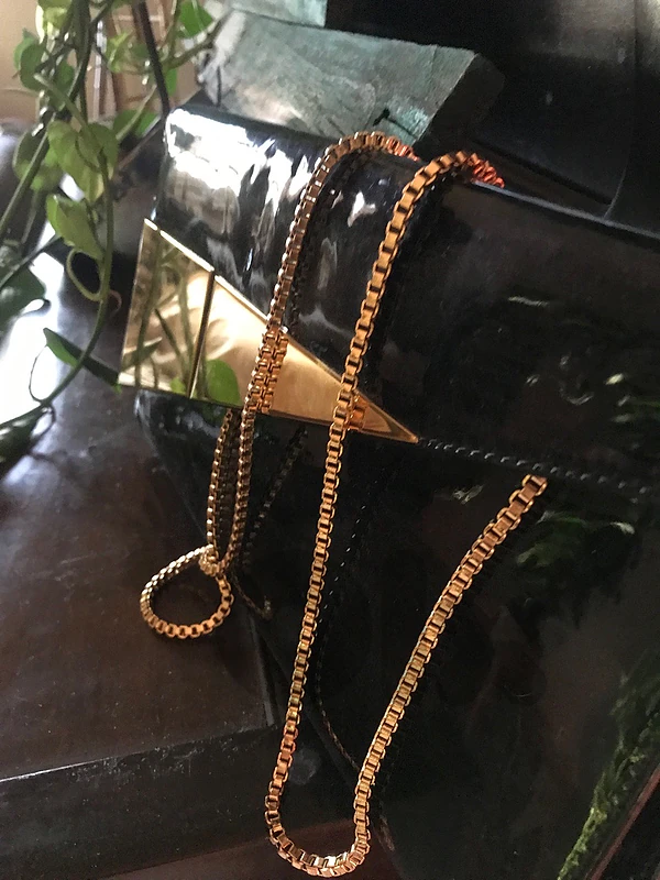 new black gold handbag