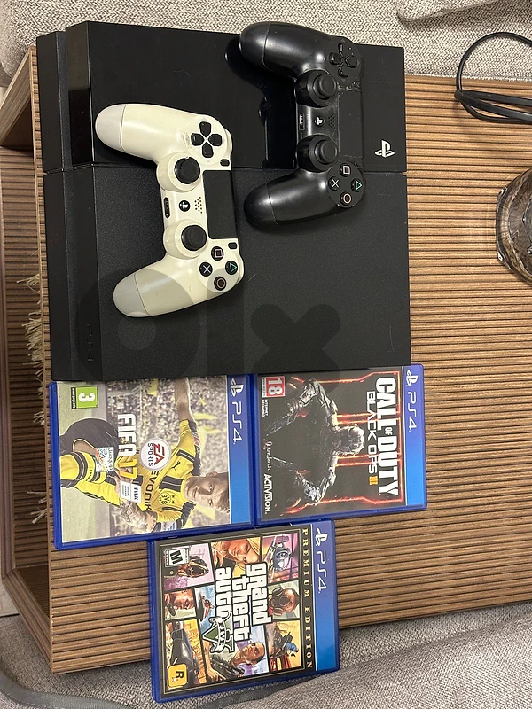 PS4 + 2 Controllers + 3 Games (GTA V, FIFA 17 & COD Black Ops III)