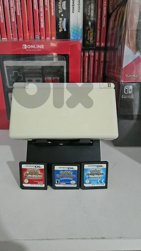 nintendo ds lite with 3 pokemon games