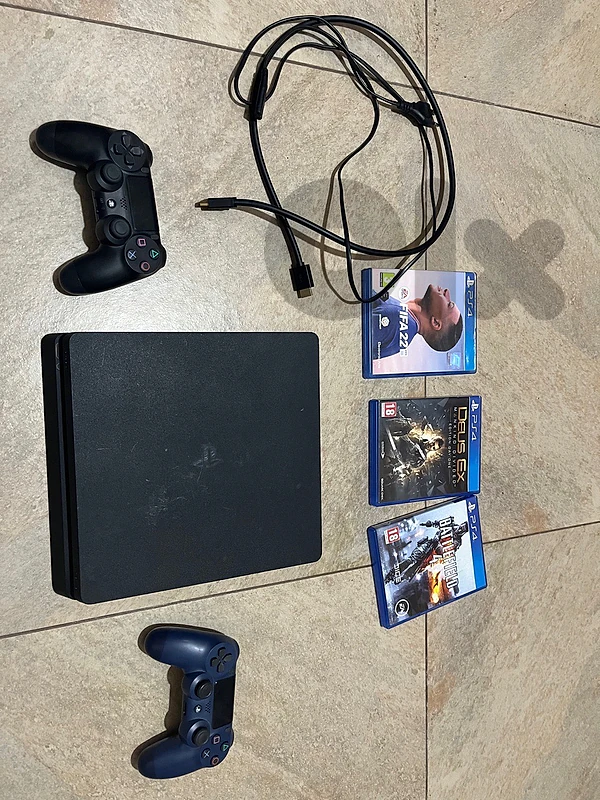 PS4 Slim 1TB + 2 Controllers + 3 Games – Excellent Condition