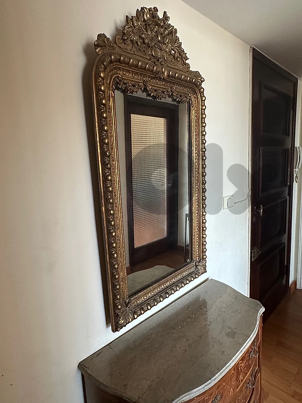 Ornate vintage gold framed wall mirror