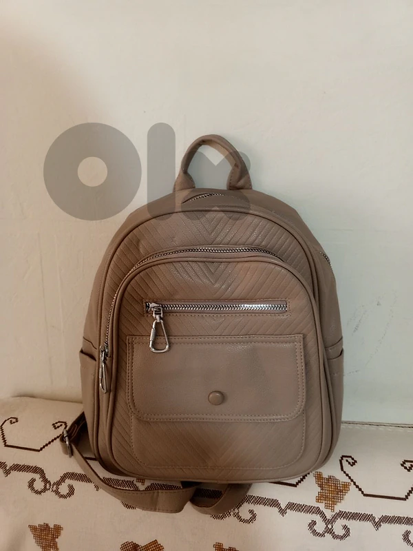 beige women backpack