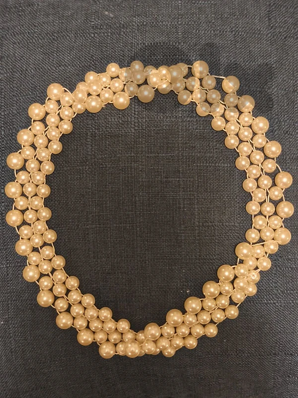 Large multi-strand pearl necklace