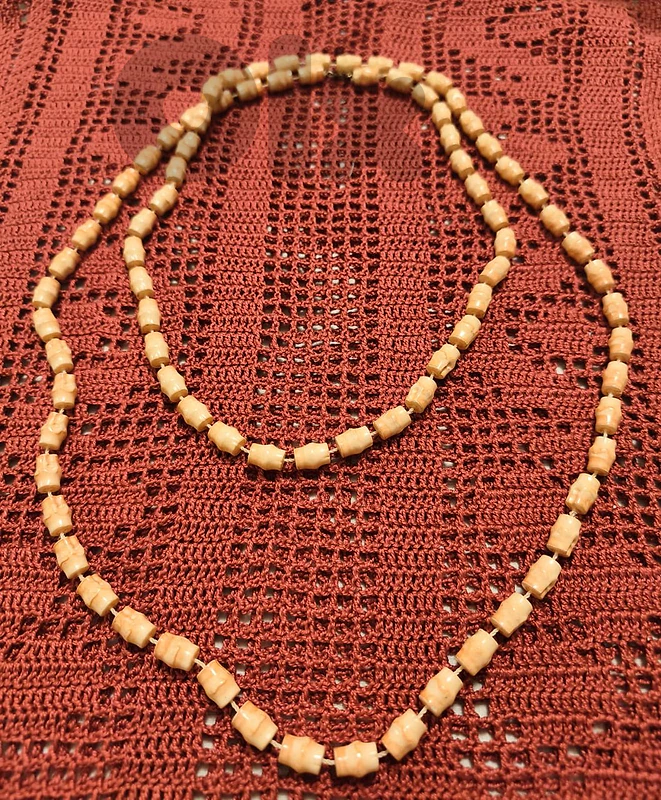Long orange/tan carved-style bead necklace