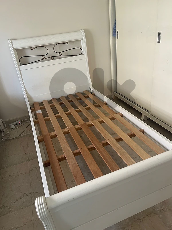 classic white wooden twin bed
