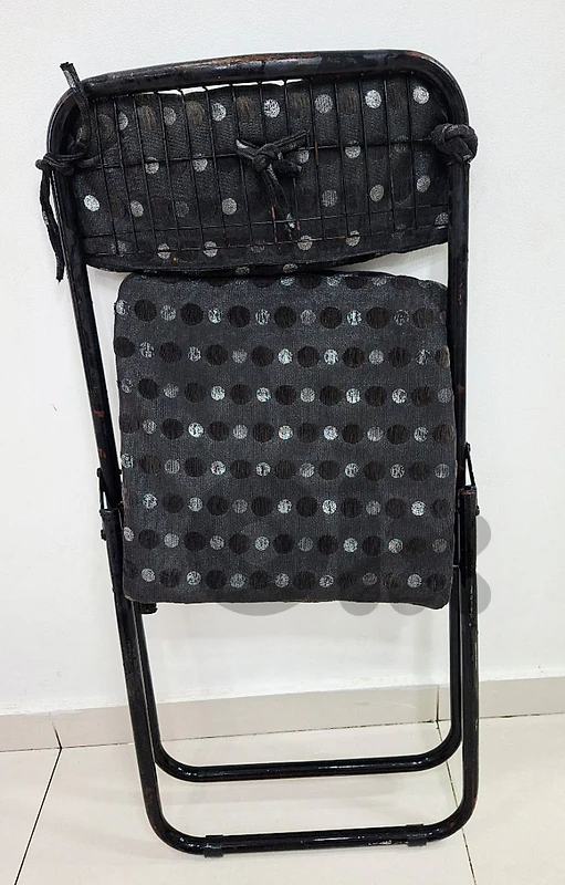 For sale  six heavy-duty black iron chairs."