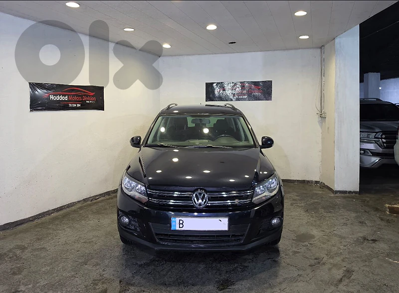 2012 Volkswagen Tiguan 2.0T 4 Motion Black/Black Company Source