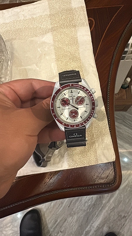 omega x swatch pluto