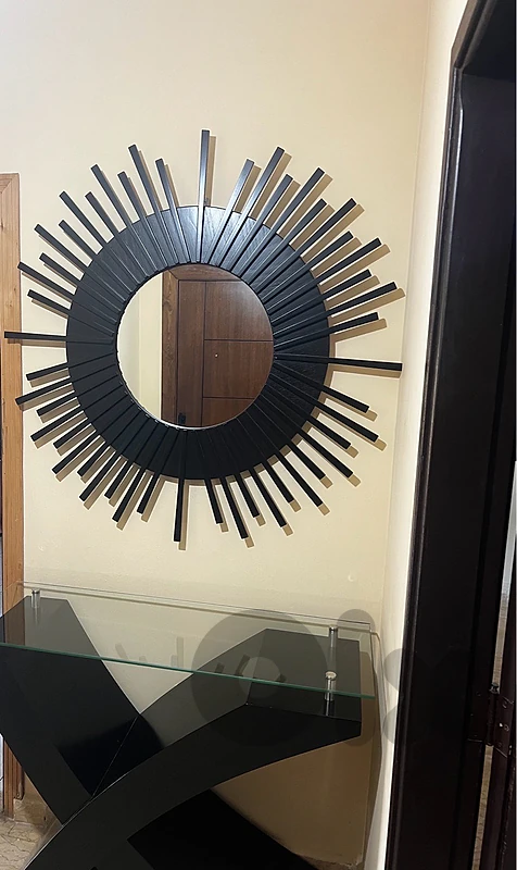 Modern black console table with Black sunburst mirror
