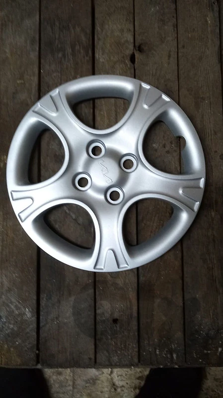 4 new iron rims 14"or wiz covers for kia.