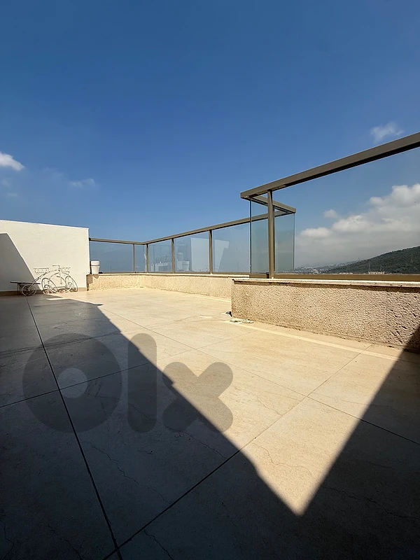 Duplex for sale in Ain Saadeh with open sea and mountain view.