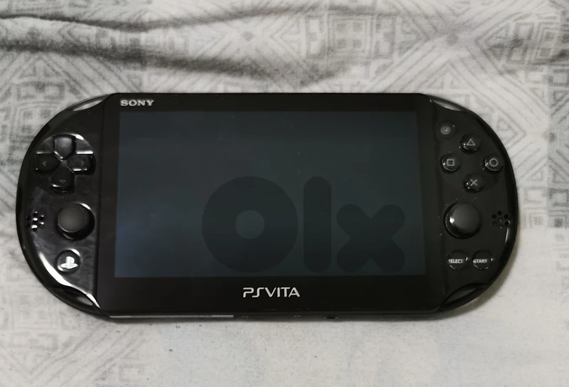 PS Vita Slim (Excellent) + Rare Sly Cooper: Thieves in Time Cartridge