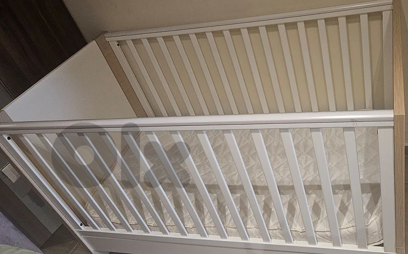 baby crib with a  mattress