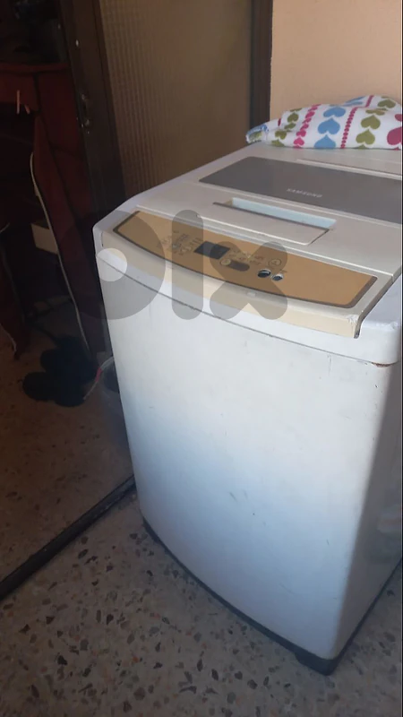 washing machine - غسالة