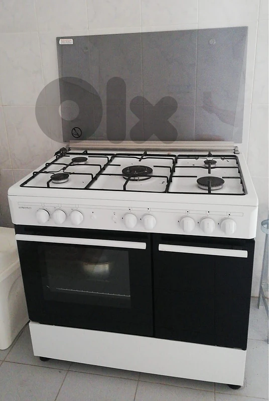white 5-burner gas cooker with oven and glass top cover