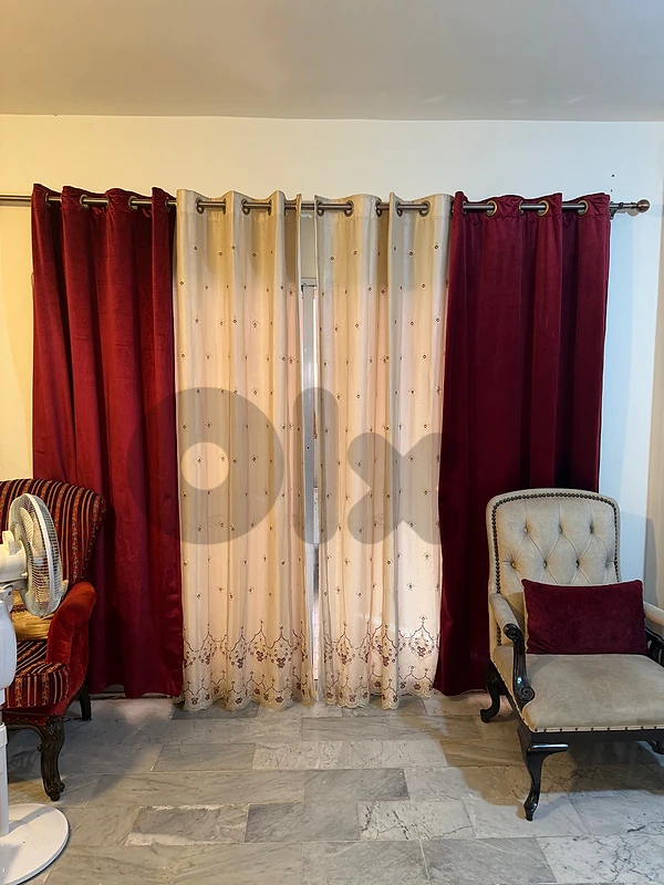 corner with salon with table and curtains