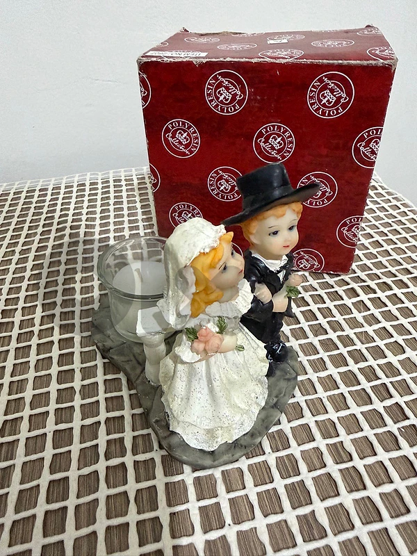 Polyresin bride and groom wedding figurine with a candle