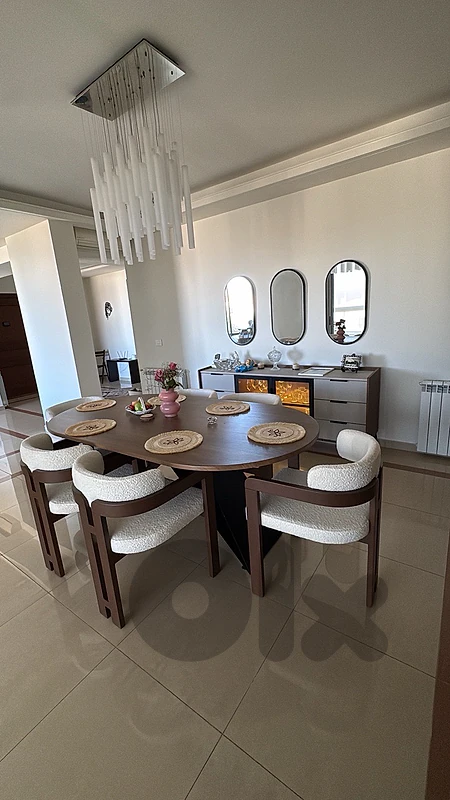 Oval Wooden Dining Table With 6 White Chairs, 3 mirrors and a console