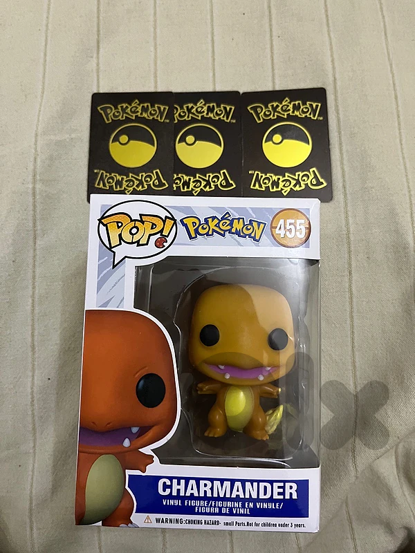 charmander funko pop with three mystery pokemons