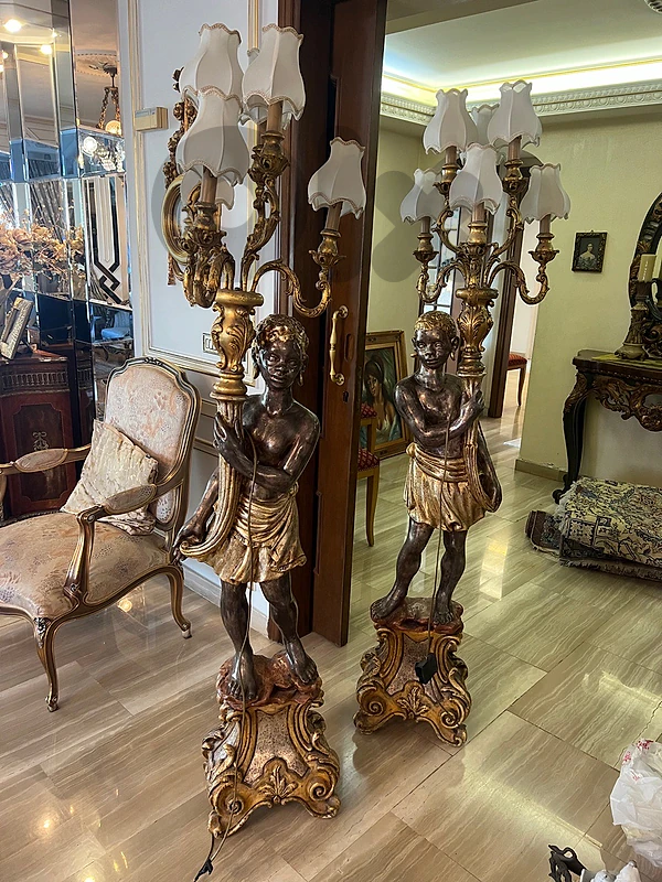 A pair of blackamoor floor standing candelabra تمثال شمعدان عدد ٢