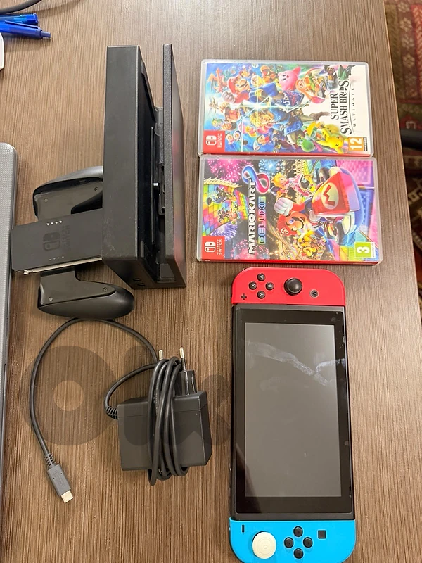 Nintendo switch oled 25gb + games;super smash bros+ Mario kart 8 delux