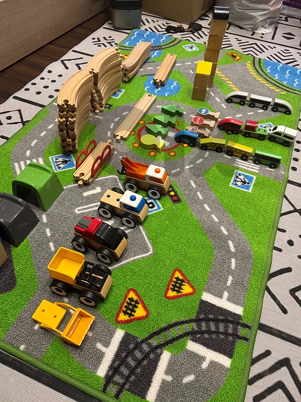 ikea carpet + train rail and cars . سجادة وسكة وسيارات